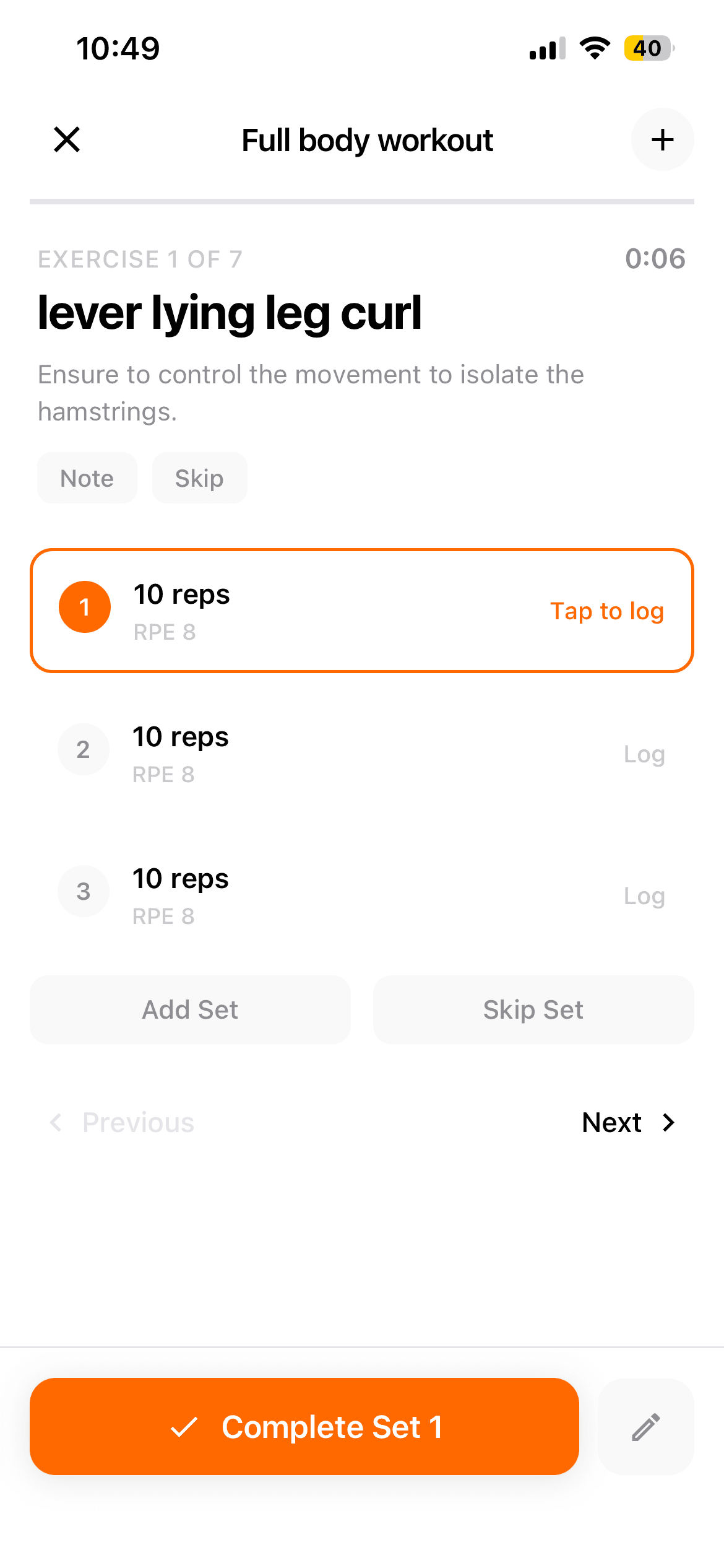 Client's phone mid-workout, logging a set with reps and RPE